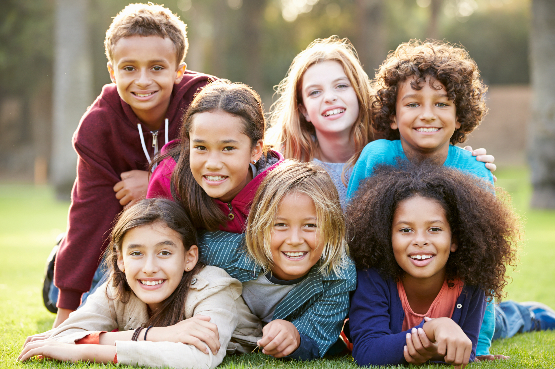 Happy children playing together outdoors